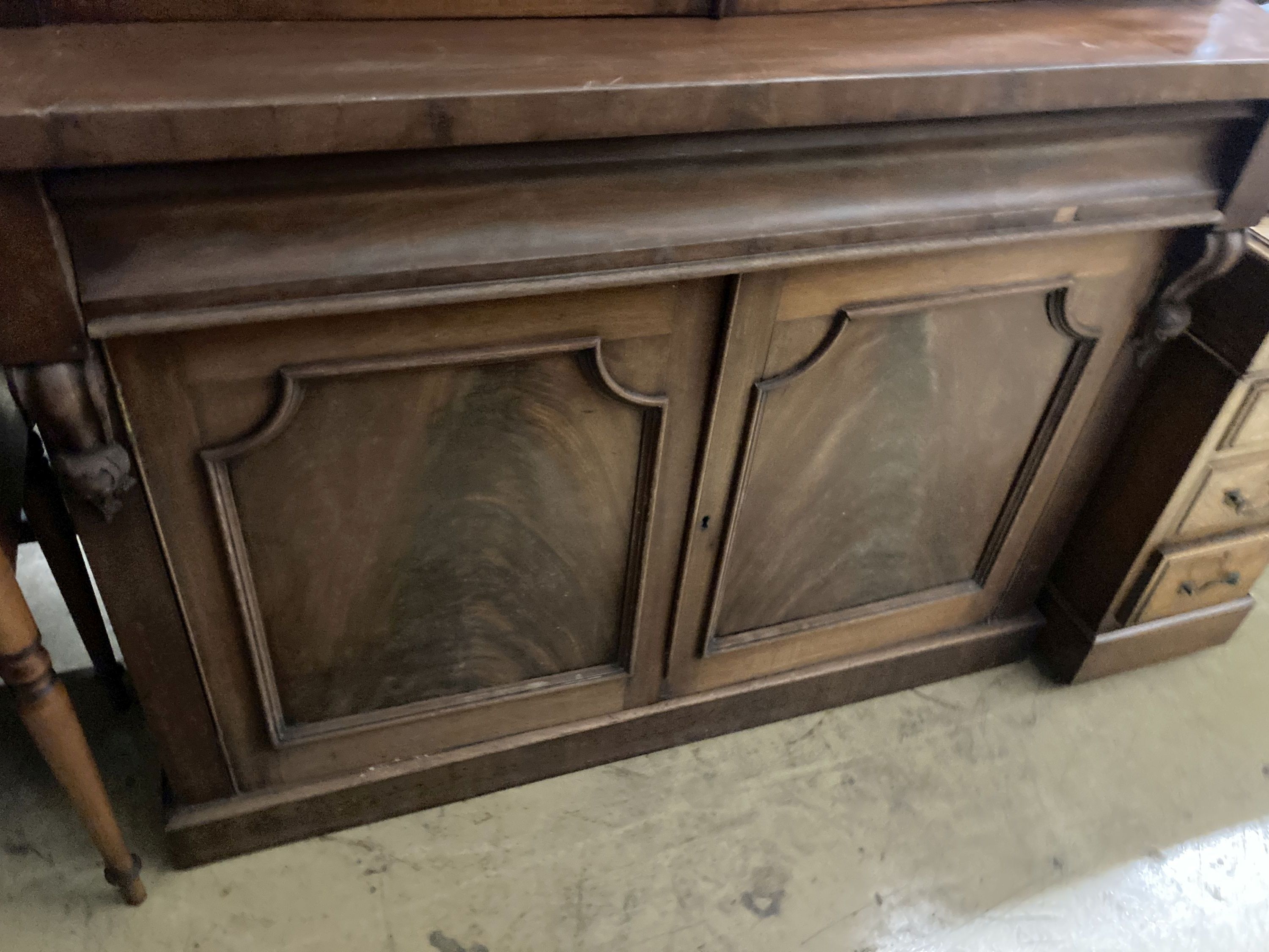 A Victorian mahogany bookcase cupboard, length 126cm, depth 51cm, height 228cm